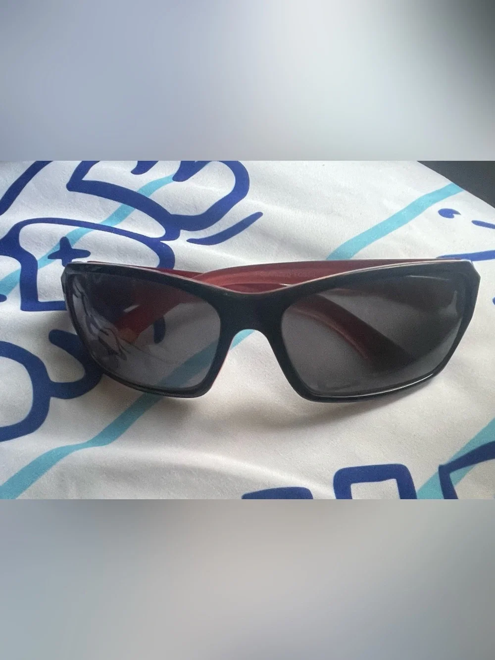 Fossil Black Sunglasses with Red Interior Accent